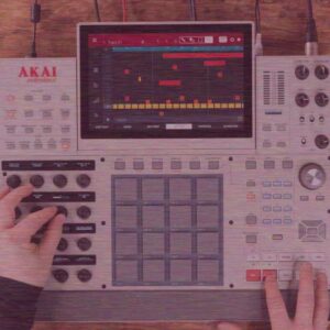 Hands using music production equipment with digital interface.