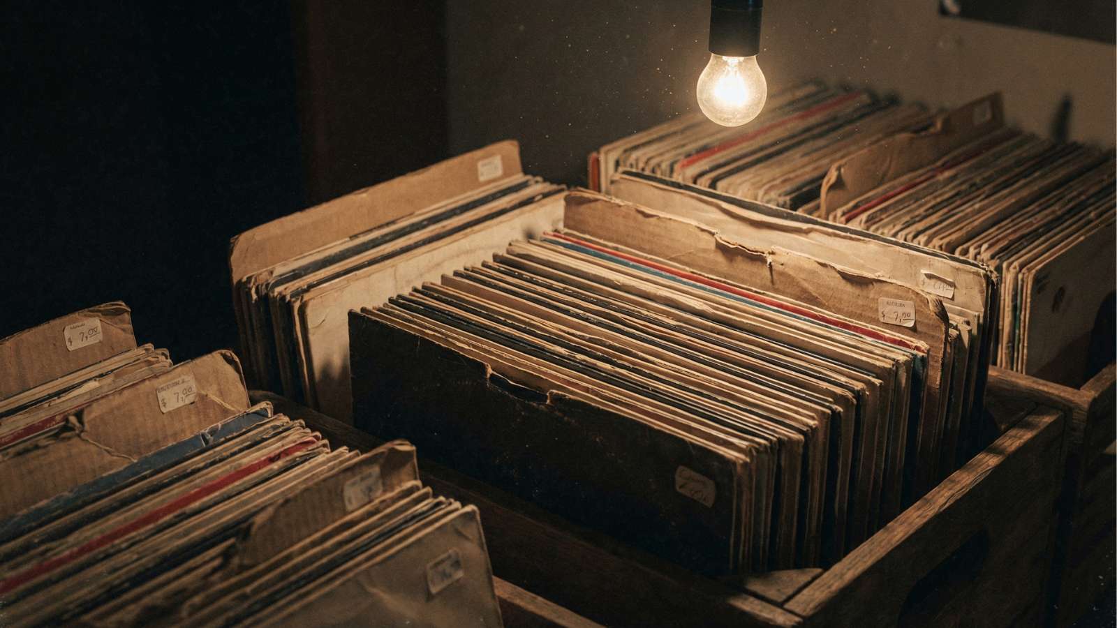Vintage vinyl records in dimly lit room.