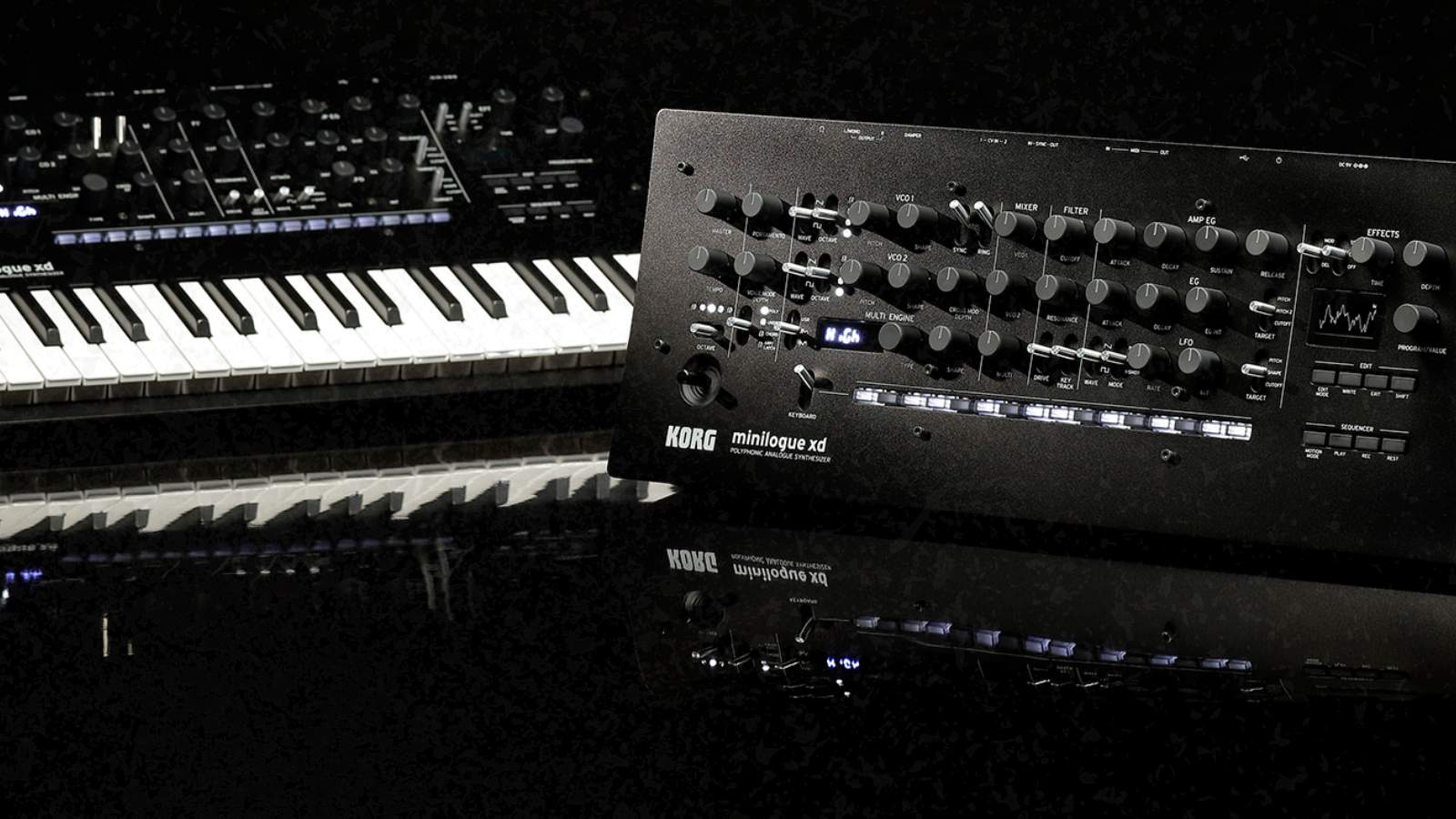 Korg synthesizer with keyboards on dark background